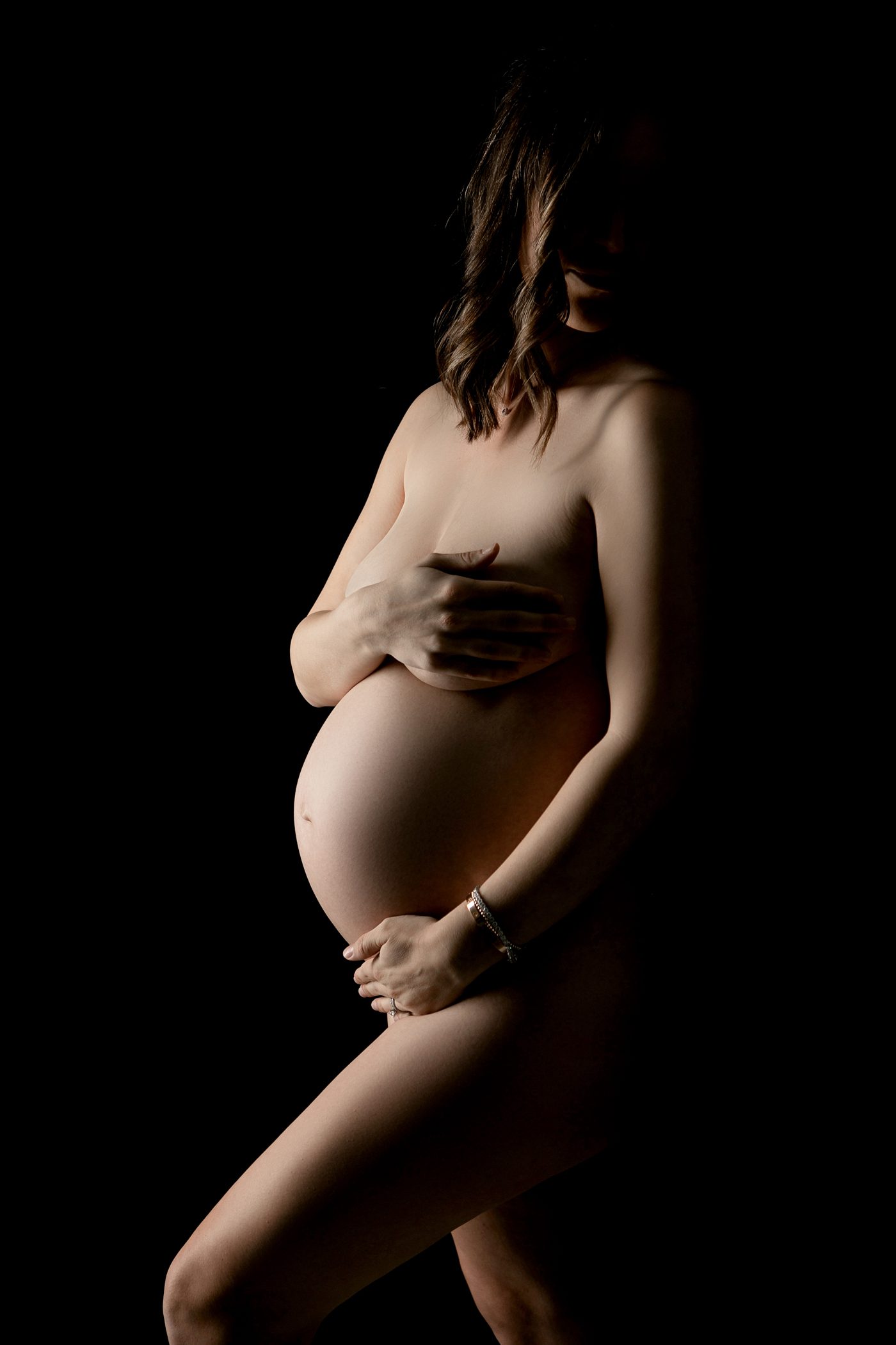 Maternity Portraits, Fresno, Clovis, Studio, black, silhouette, side light, nude belly, maternity pose