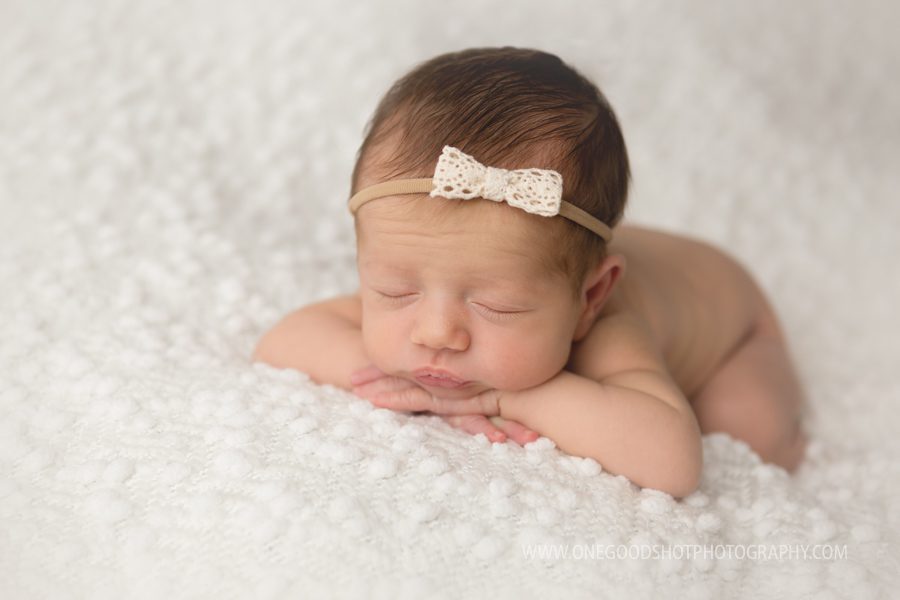 newborn girl head on hands, white, simple, newborn photographer, fresno, ca