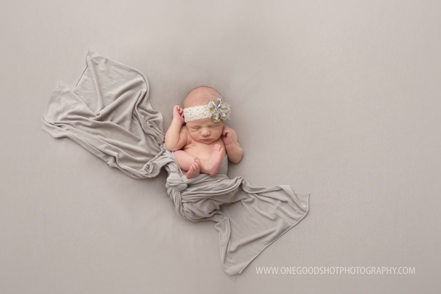 newborn baby girl, baby led posing, wrapped in gray