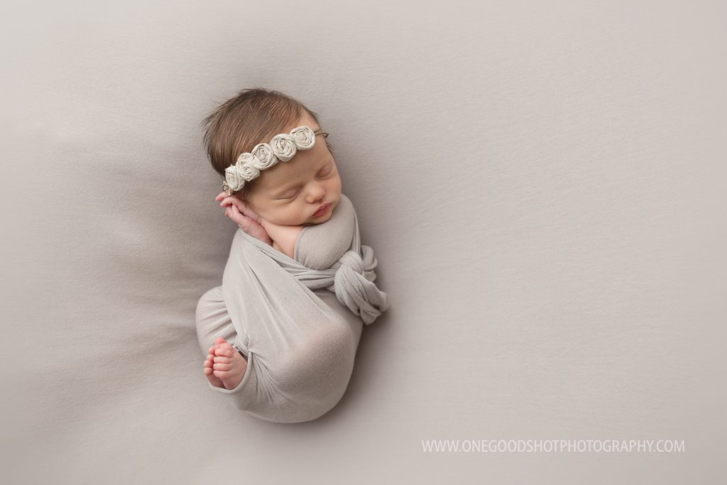 newborn girl, gray wrap and backdrop
