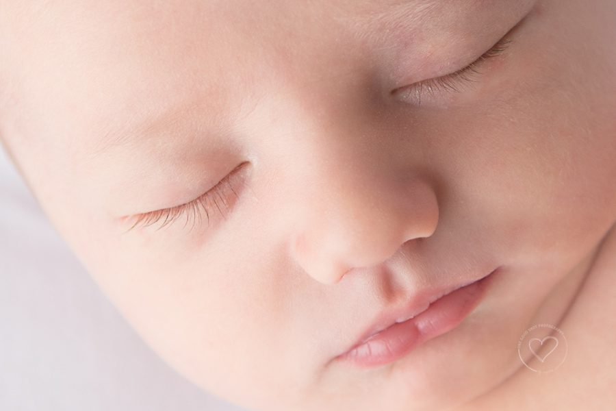 newborn boy, close up of  face, long eyelashes
