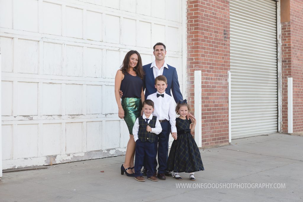 Family pictures, urban, downtown, red brick wall, dress clothes, fresno photographer