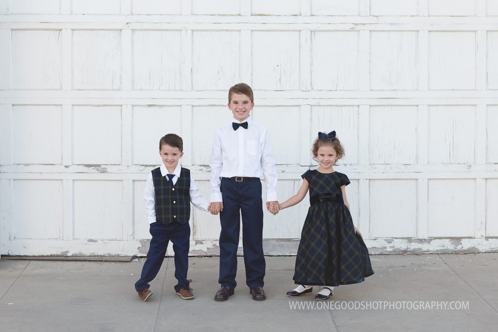 Family pictures, urban, downtown, red brick wall, dress clothes, fresno photographer, siblings