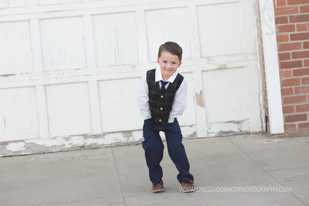 Family pictures, urban, downtown, red brick wall, dress clothes, fresno photographer, boy