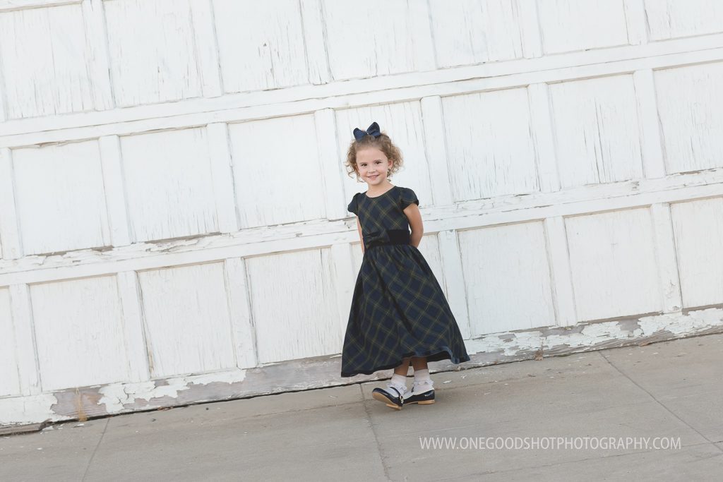 Family pictures, urban, downtown, red brick wall, dress clothes, fresno photographer, girl