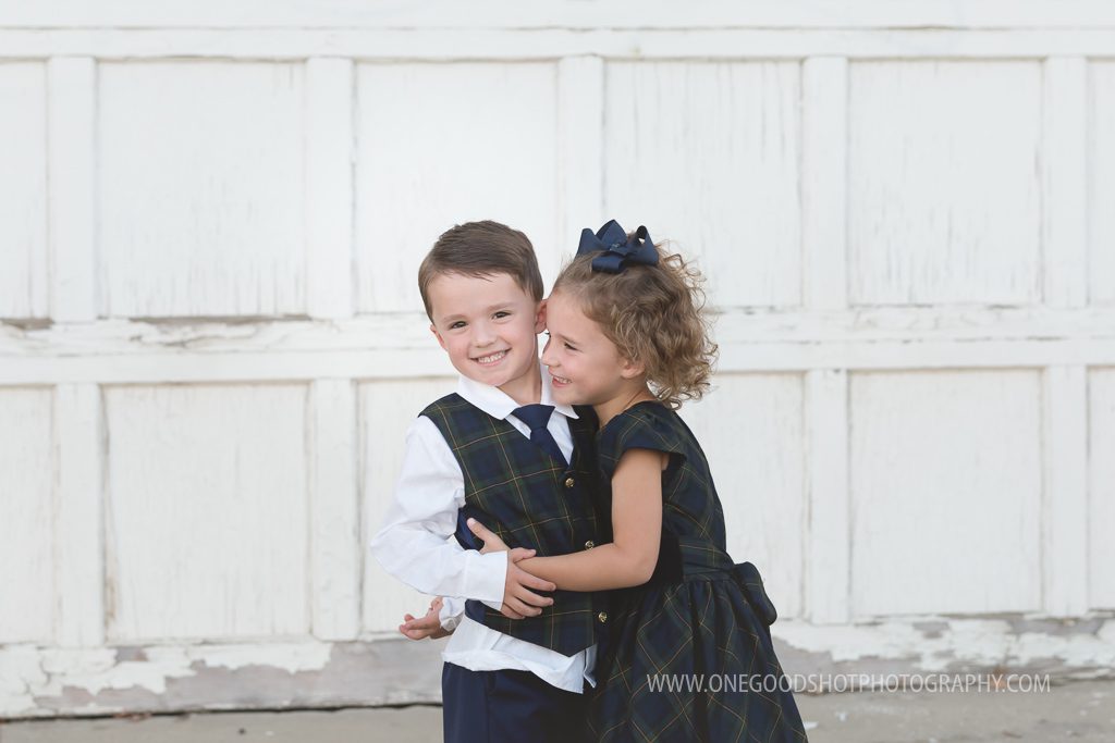 Family pictures, urban, downtown, red brick wall, dress clothes, fresno photographer, twins