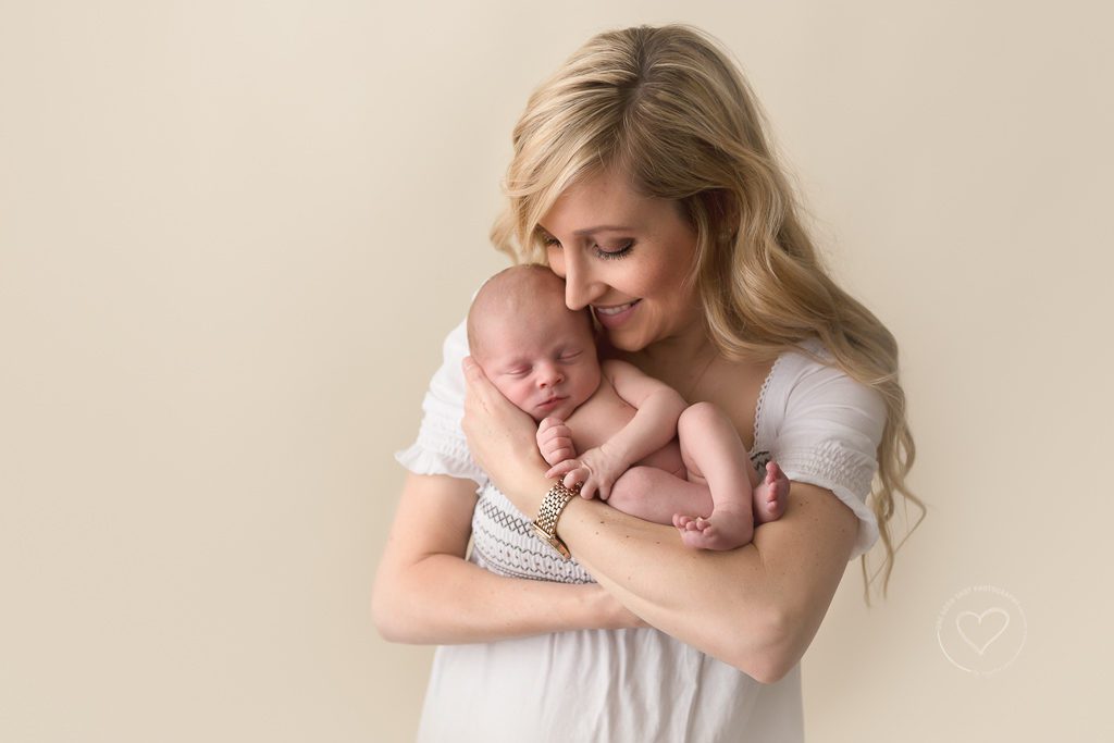 newborn boy in moms arms, fresno newborn photographer