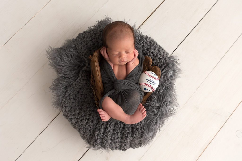 Newborn boy in baseball glove, Fresno newborn photographer