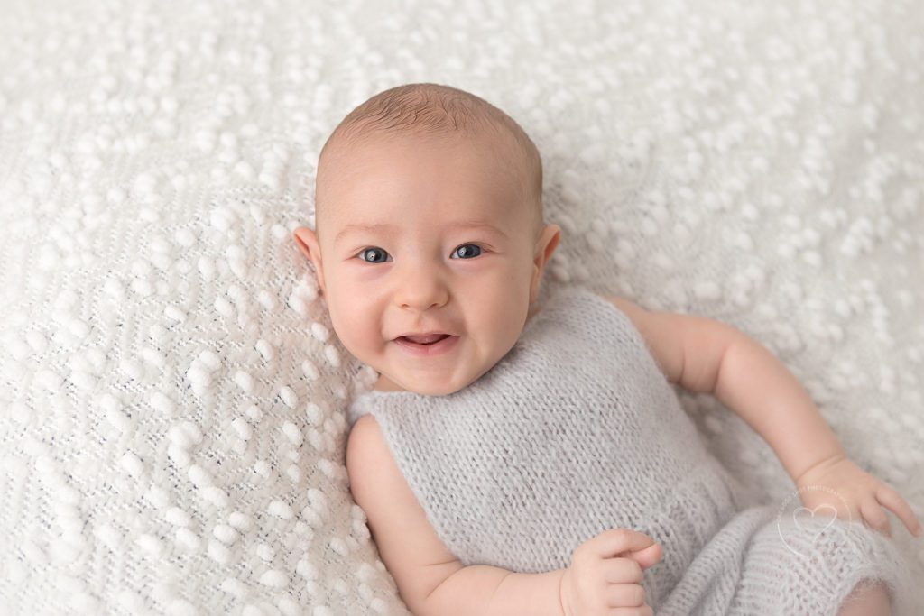 Fresno Baby Photographer | One Good Shot Photographer, Fresno, Clovis, CA, Baby photos, 3 months old, Milestone session, natural posing, neutral baby, smiling baby, happy baby, white backdrop, gray knit romper