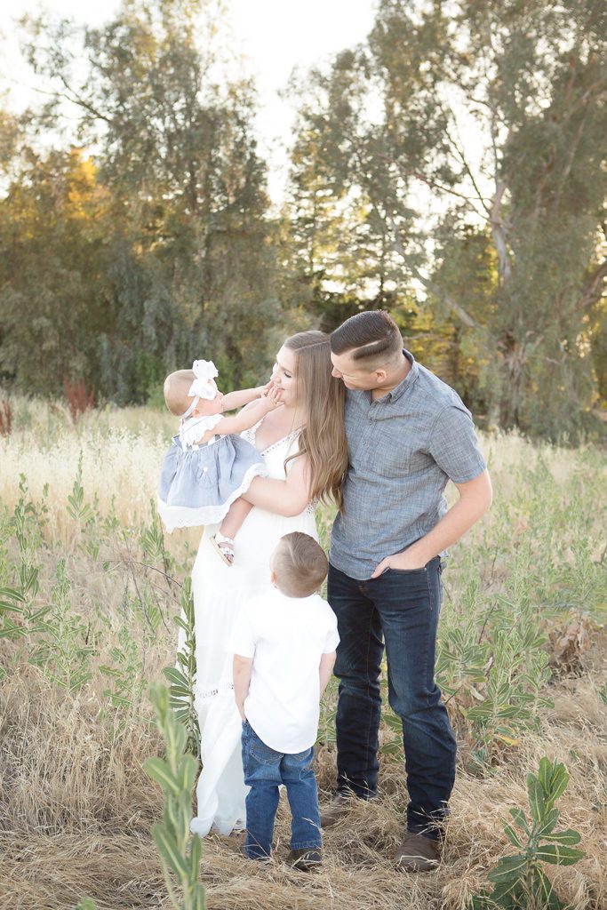 Fresno family photographer, vintage, candid smiles, family on a field