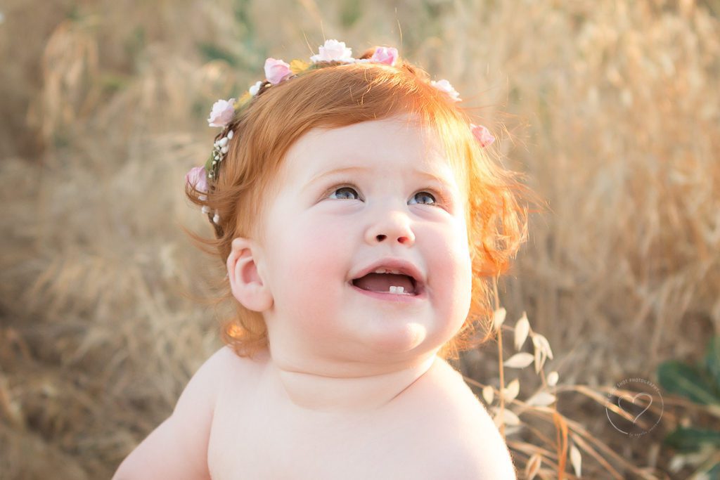 fresno baby photographer, first birthday girl, flower halo, field