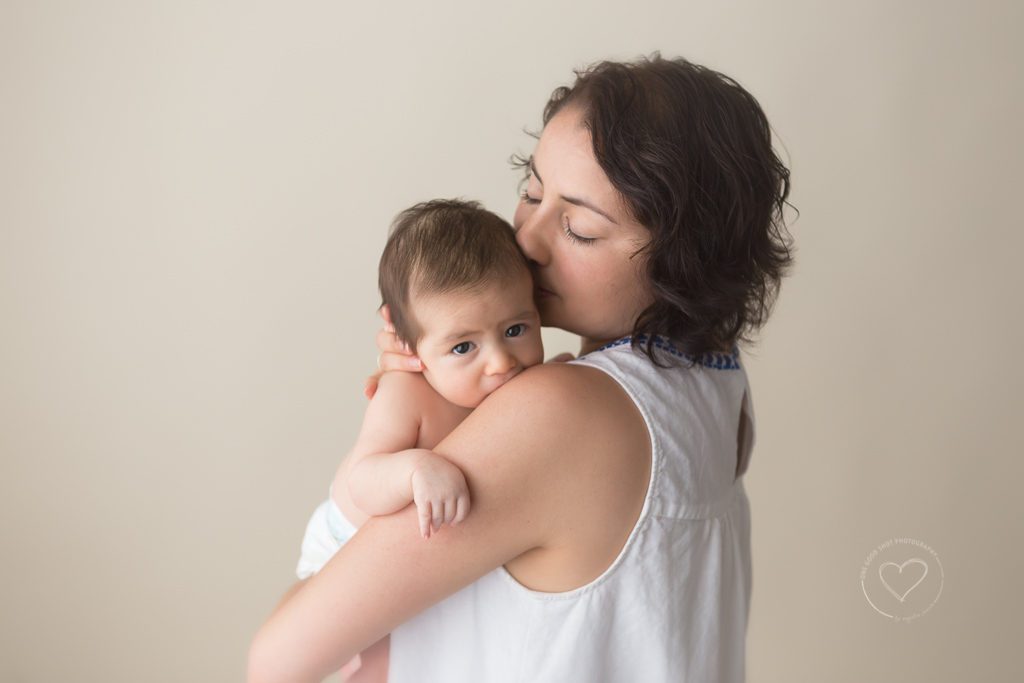 Fresno Baby Photographer, Milestone Session, Mommy kissing Baby