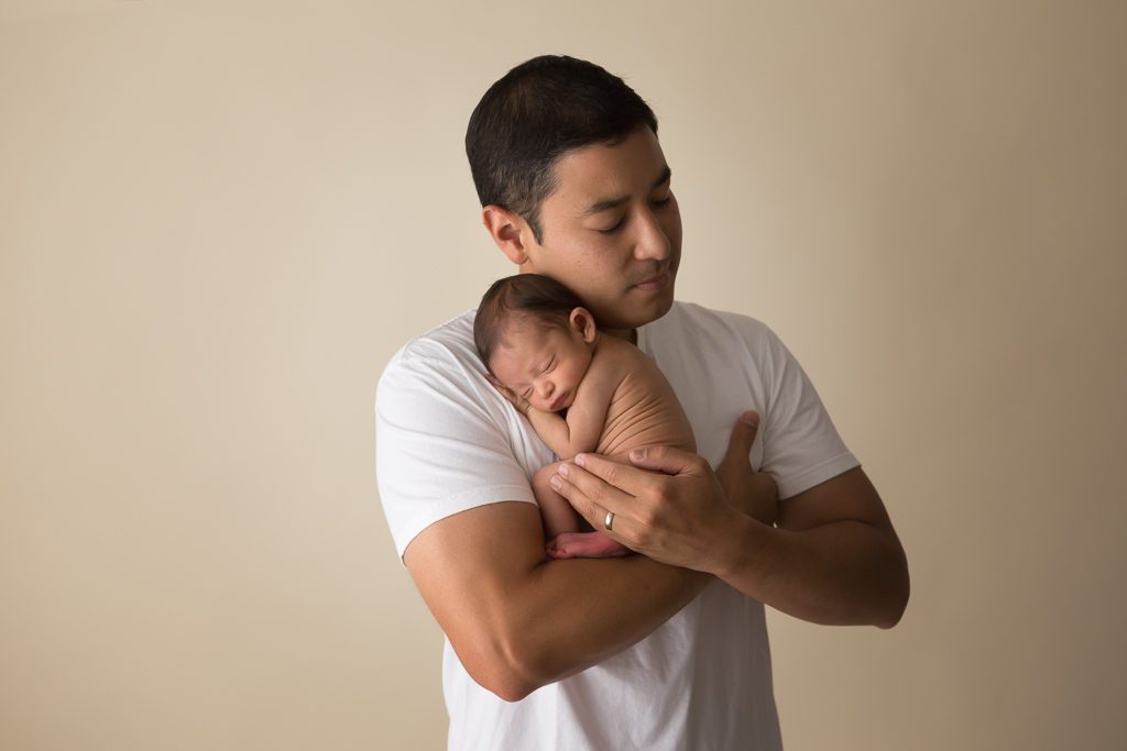 One Good Shot Photography, Fresno Newborn Photographer, Father holding Newborn Son