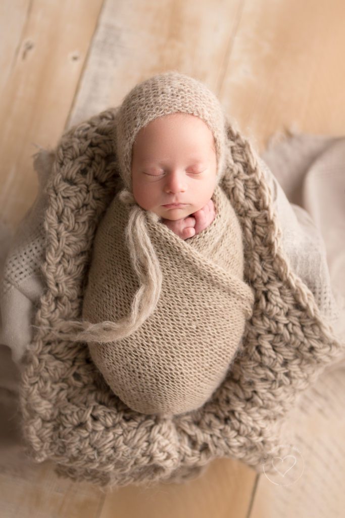 Newborn baby photographer, fresno, clovis, twin boy, wrapped, wearing bonnet, placed in box, neutral layers