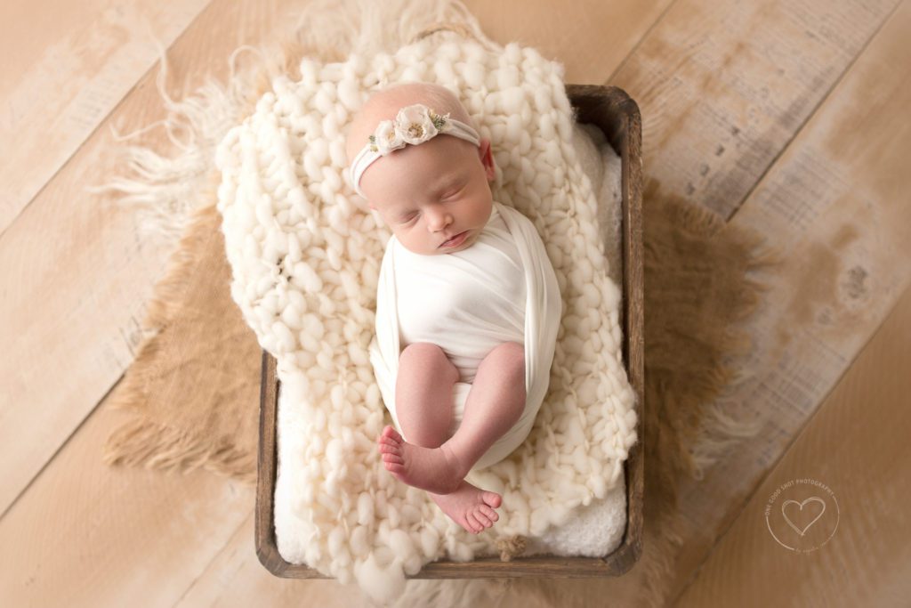Newborn baby photographer, fresno, clovis, twin girl, wrapped, floral headband, placed I box, neutral layers