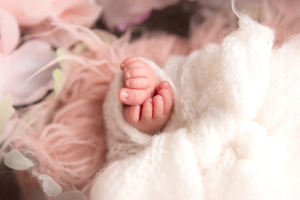 Fresno newborn photographer, baby girl toes, wrapped in white 
