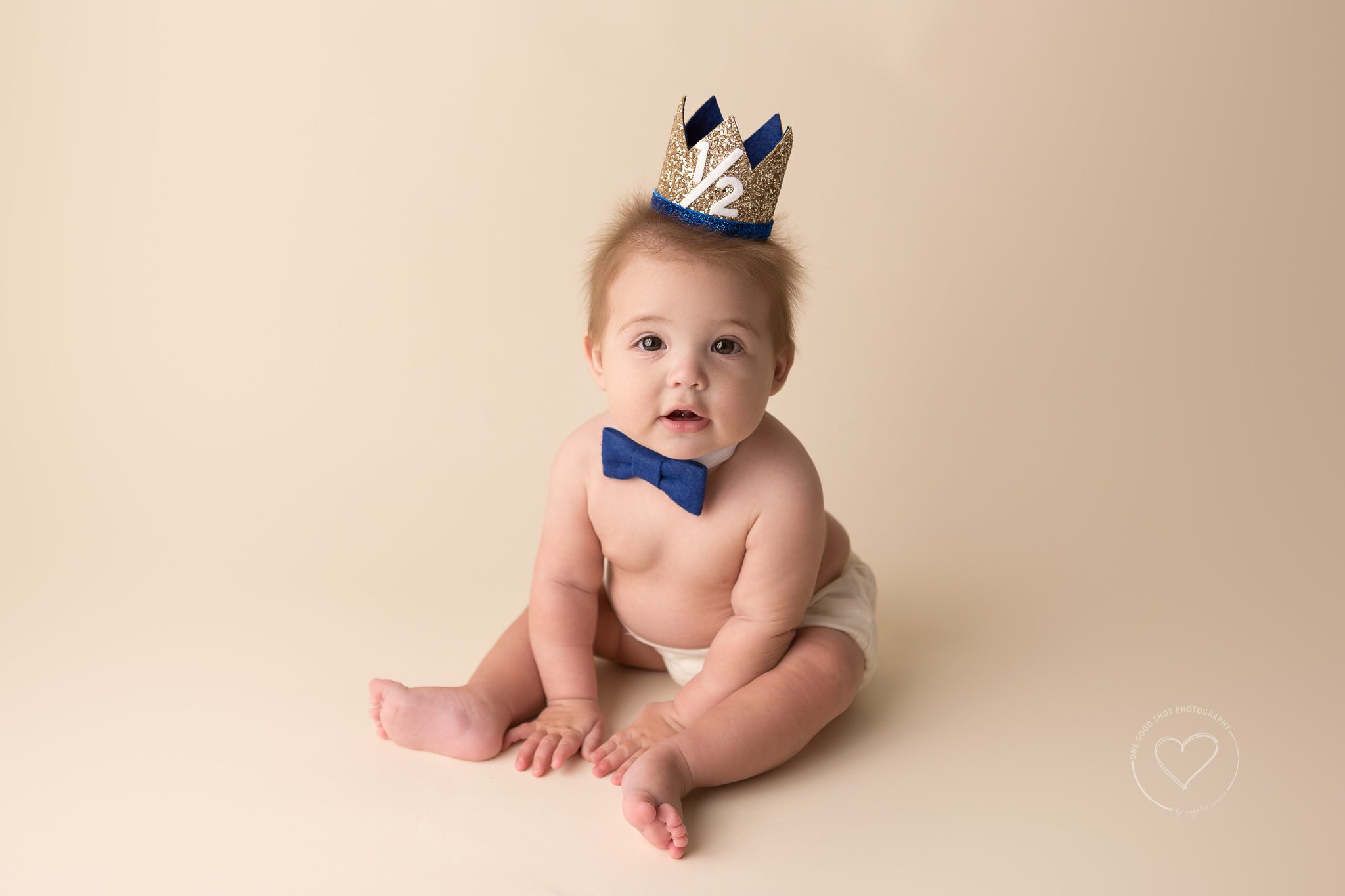 baby boy, 6 months old, half birthday, sittier, wearing blue boy tie and prince crown, Fresno baby photographer
