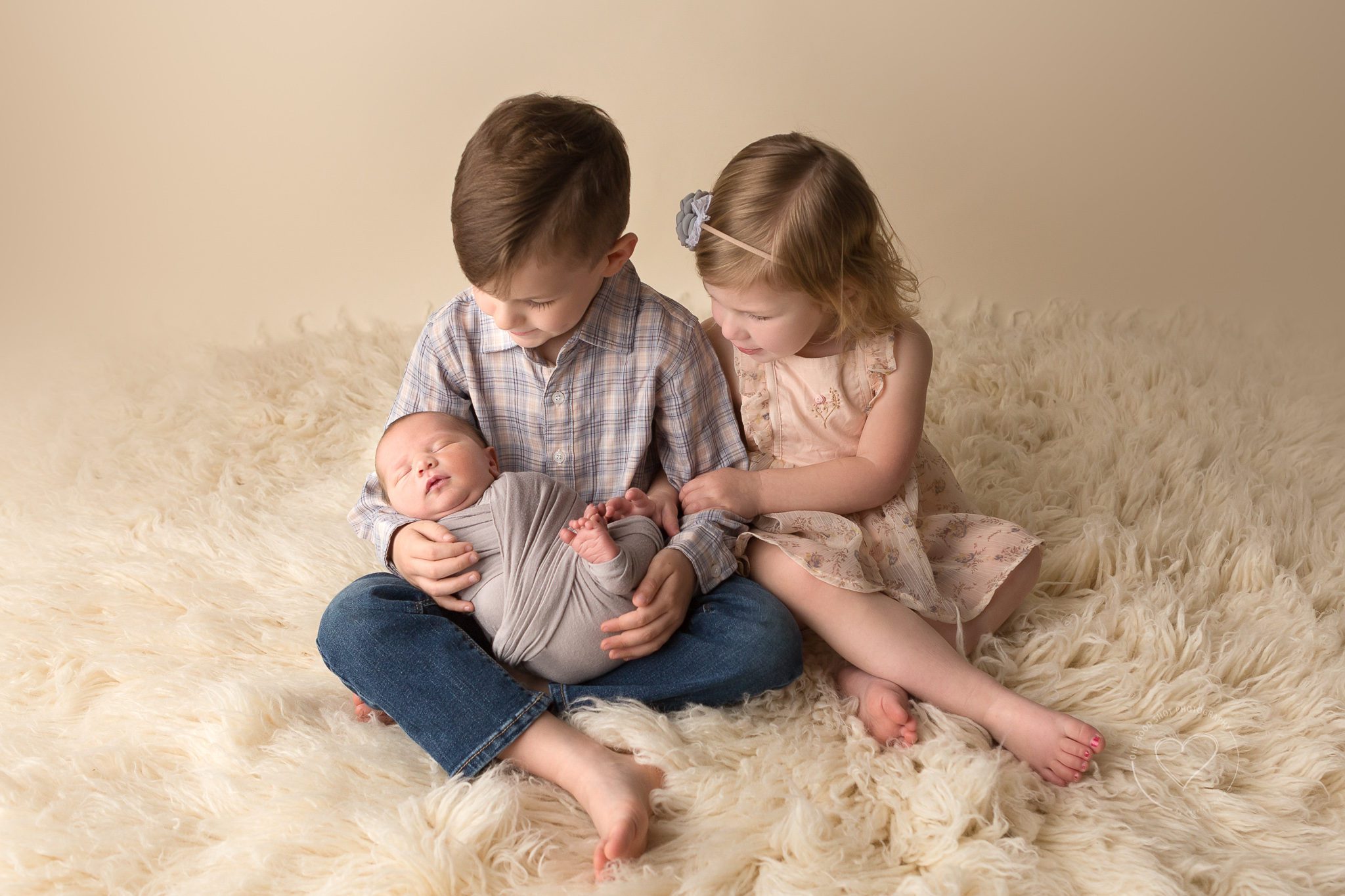 Newborn sibling photography, brother and sister holding newborn brother, Fresno, Clovis, ca