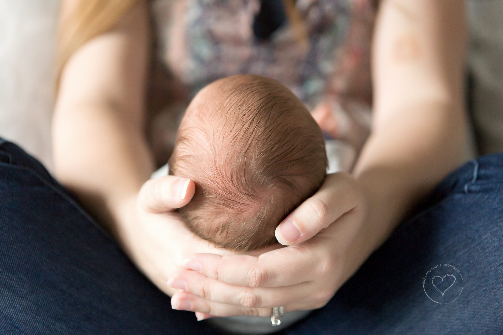 Newborn LifestylePhotography, Mom holding baby's head in hands, Baby hair