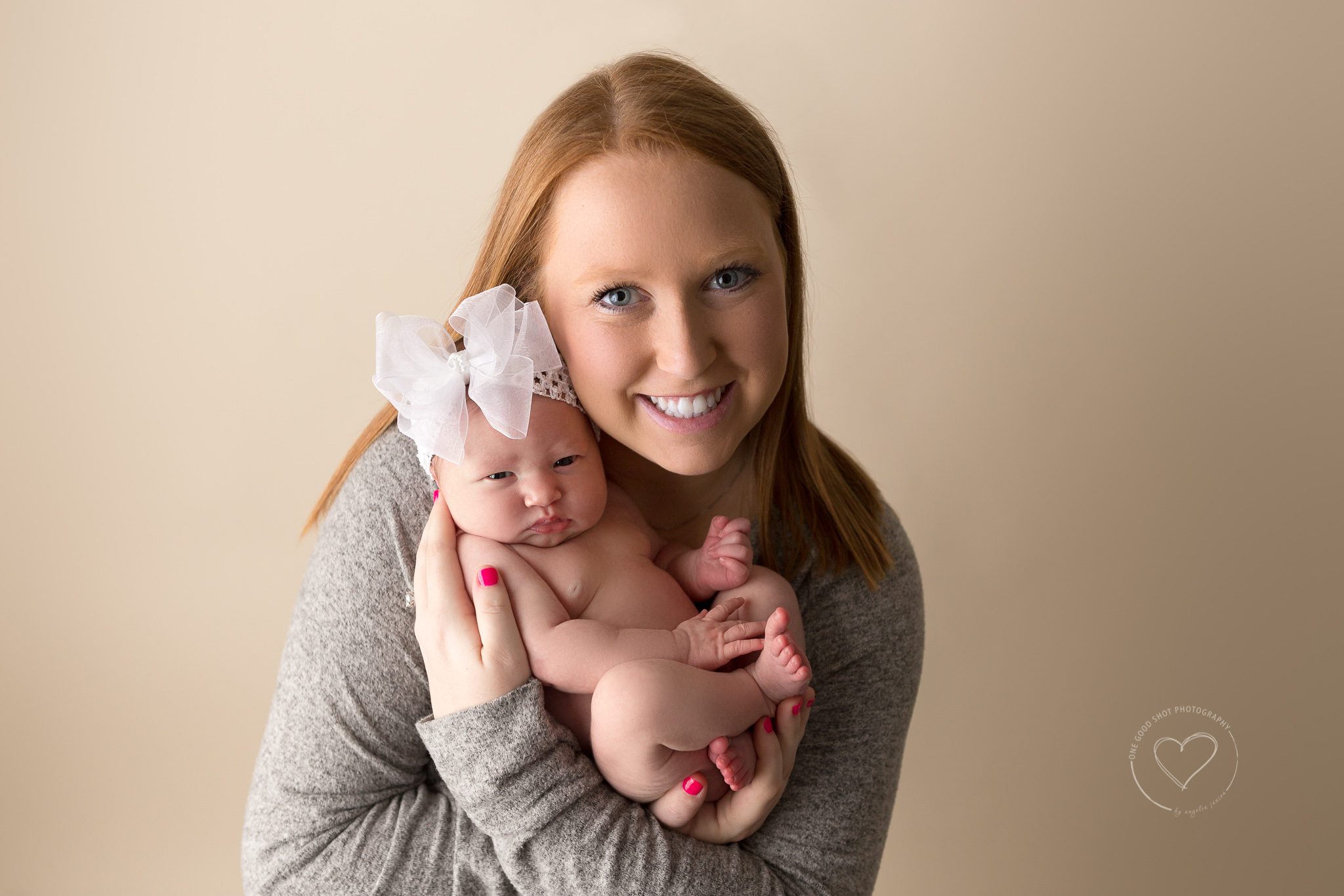 mommy and newborn baby girl, wearing big white bow, baby awake, Fresno, photographer