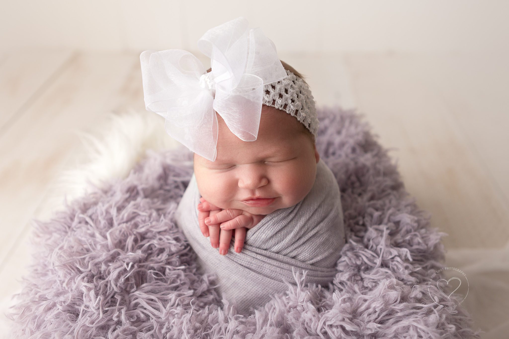 Fresno Newborn Baby Girl, Potato sack pose, big white bow, lavender fluff