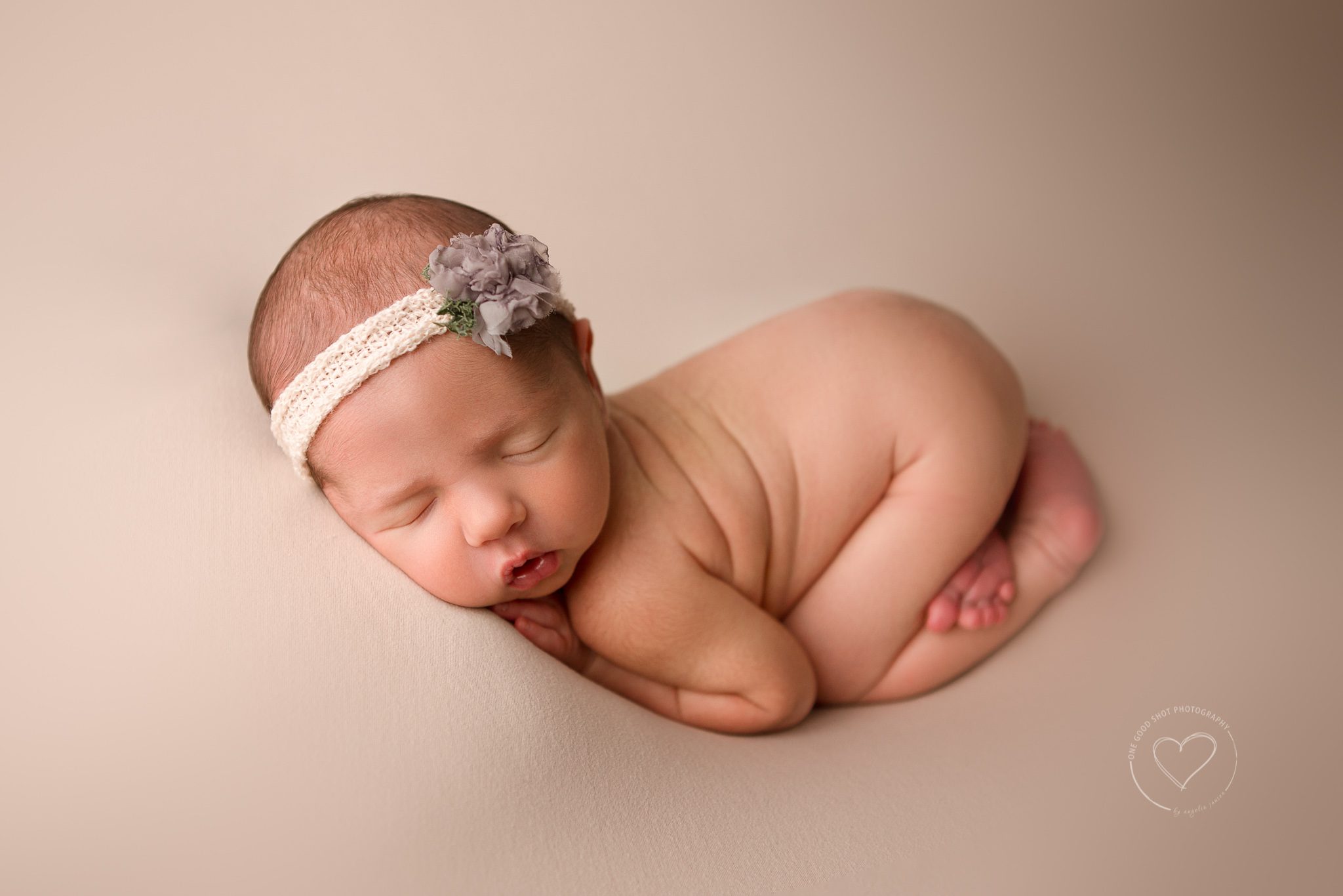 Fresno Newborn Photographer, Newborn Girl, Bum up, Tushy up, Neutral Backdrop, Floral headband, Sleeping, One Good Shot Photography