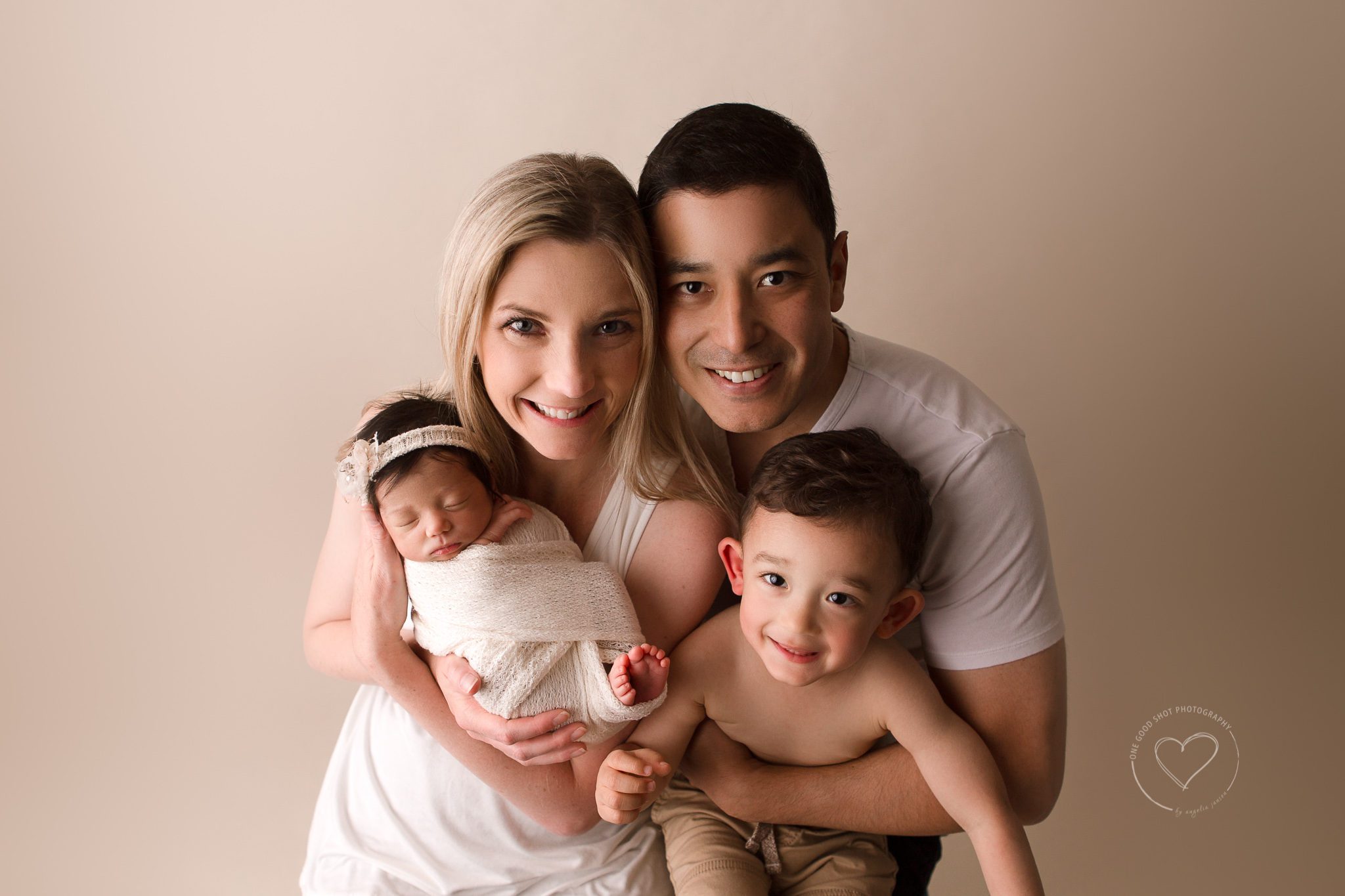 Fresno newborn family photographer, first family photo, big brother smiling, baby sister