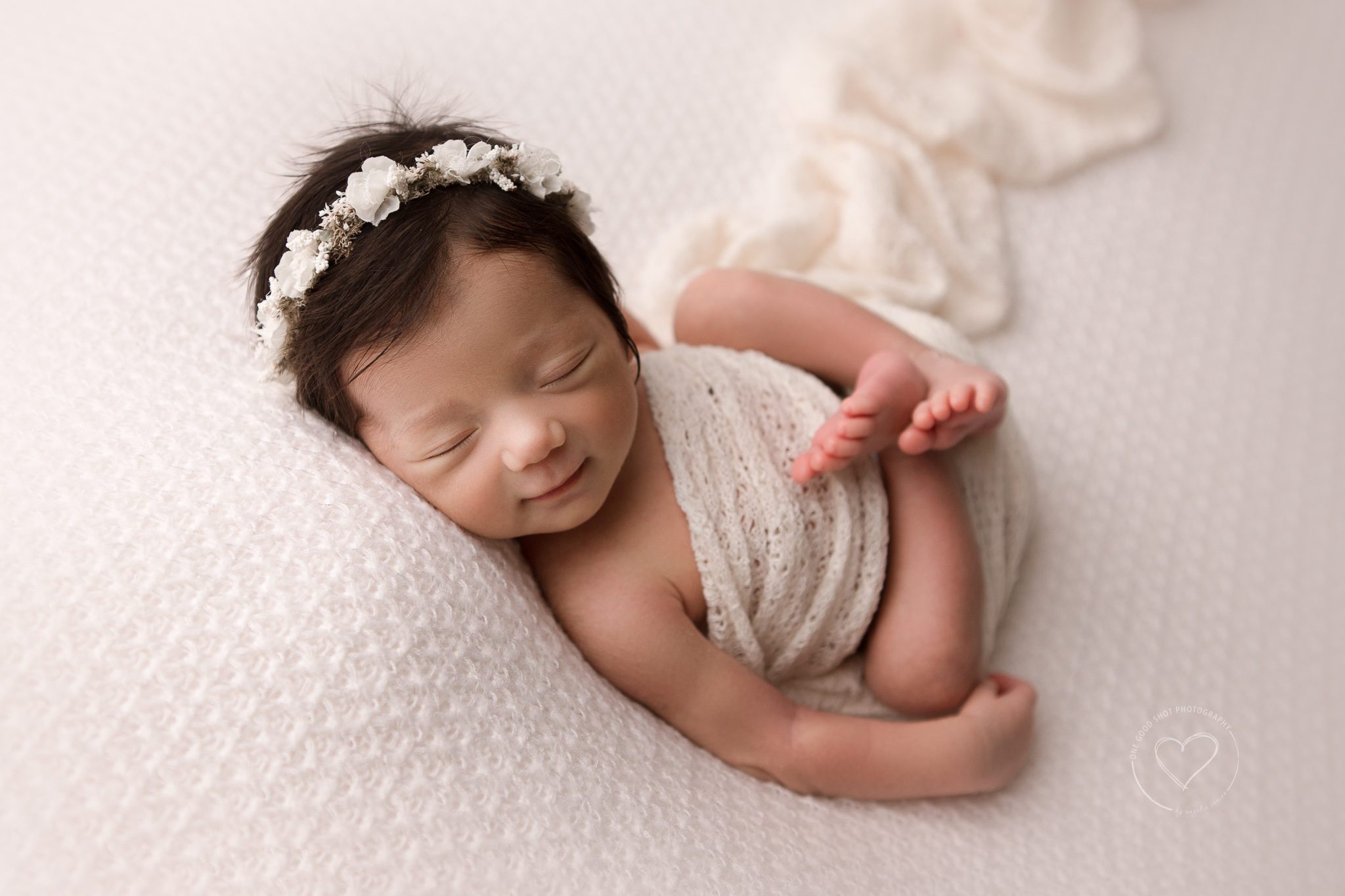 Fresno Newborn Photographer, huck finn pose, baby girl smiling, wearing floral halo