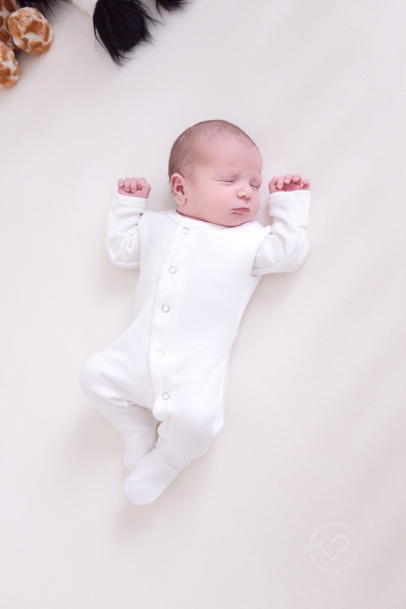 fresh 48 session, newborn baby boy wearing white sleeper, sleeping in crib, fresno, one good shot