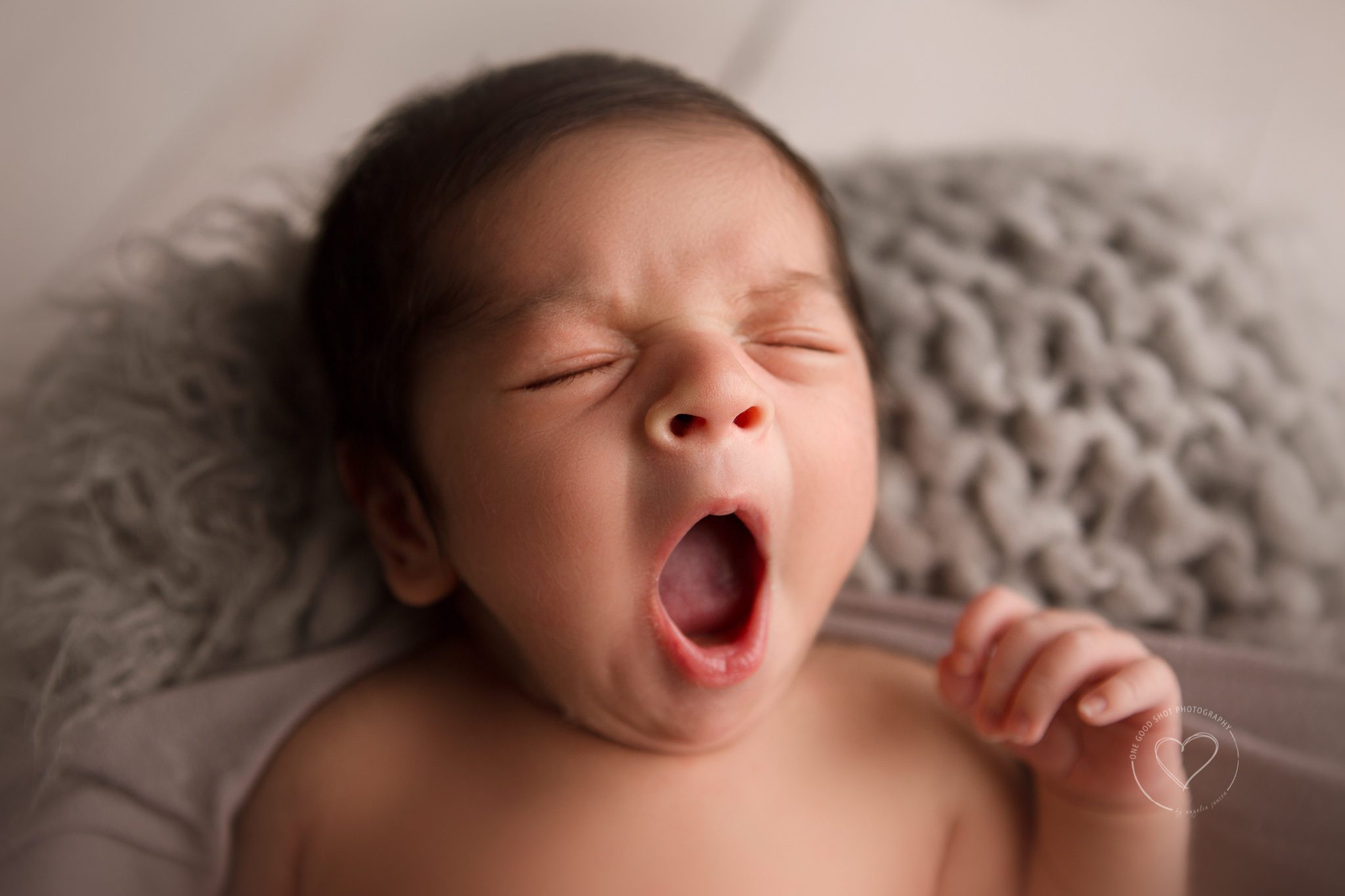 Newborn Photographer Fresno, baby boy yawning, neutral colors, one good shot