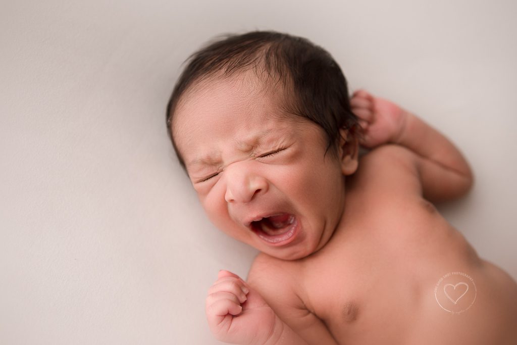 Fresno newborn photographer baby yawning