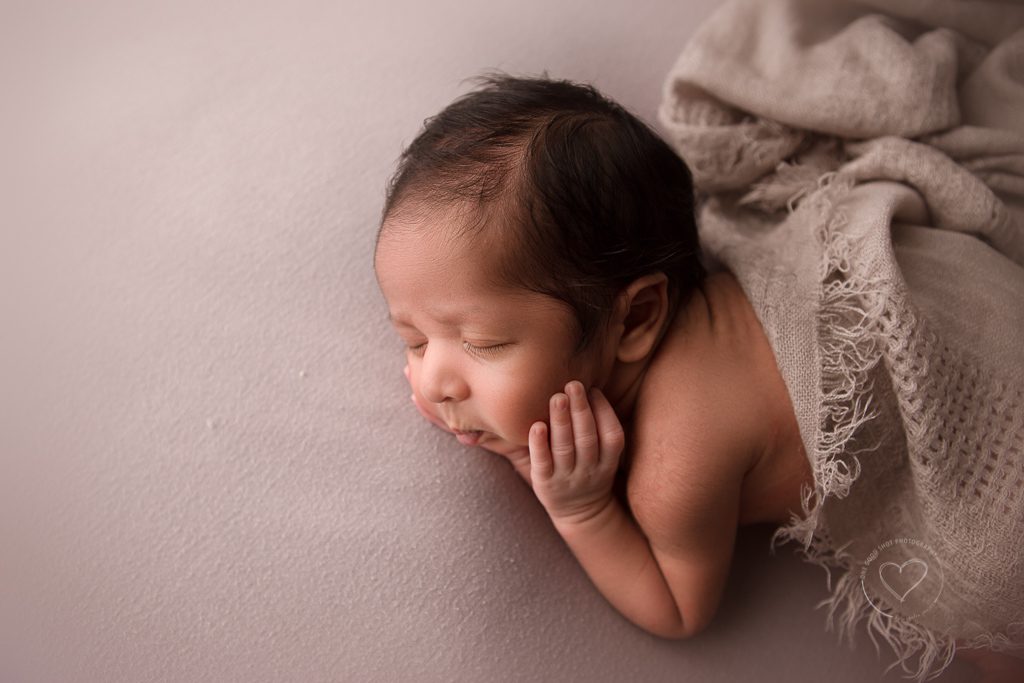 fresno newborn photographer, side lying pose, face in hands