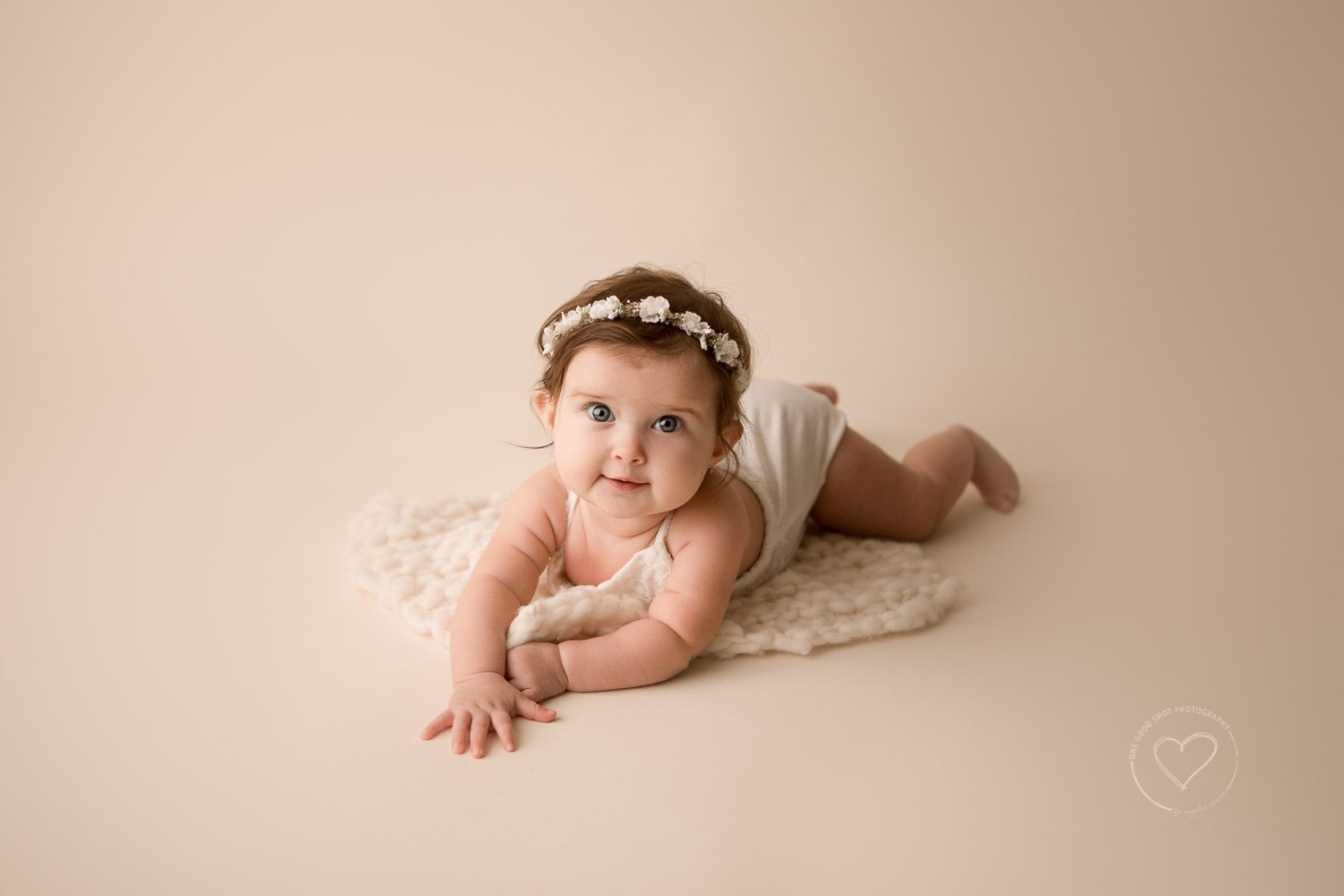 6 month baby milestone photo, neutral colors, white romper, floral halo, wool layer, tummy pose, fresno, clovis, photographer