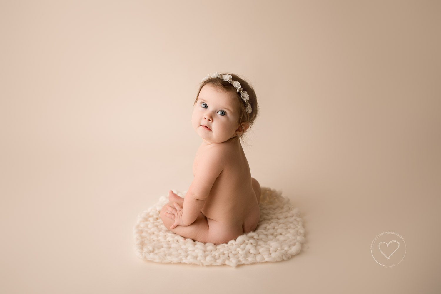 6 month milestone photo, baby girl, sitting on wool layer, wearing lfloral halo, fresno, clovis, photographer