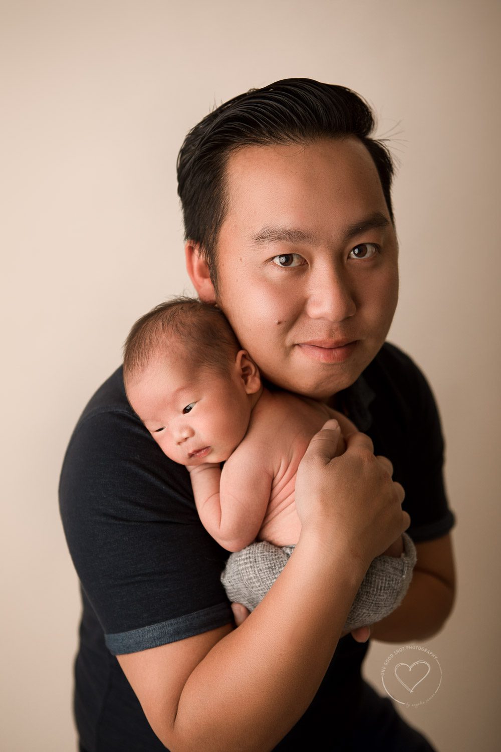 Newborn baby boy in dad's arms, fresno, clovis, photographer 