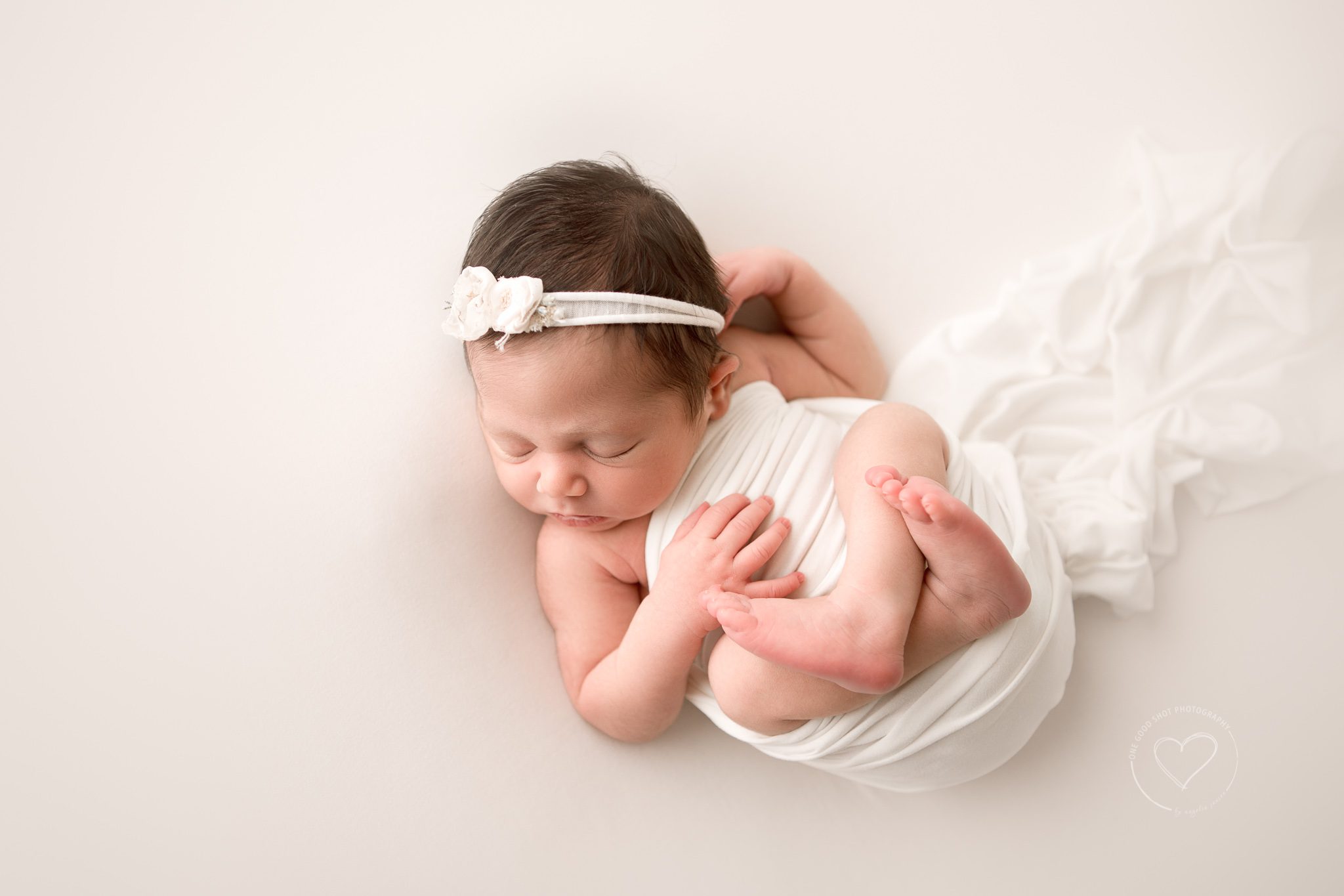 newborn girl photo, relaxed tuck finn pose, shot from above, neutral, white, fresno, clovis photographer