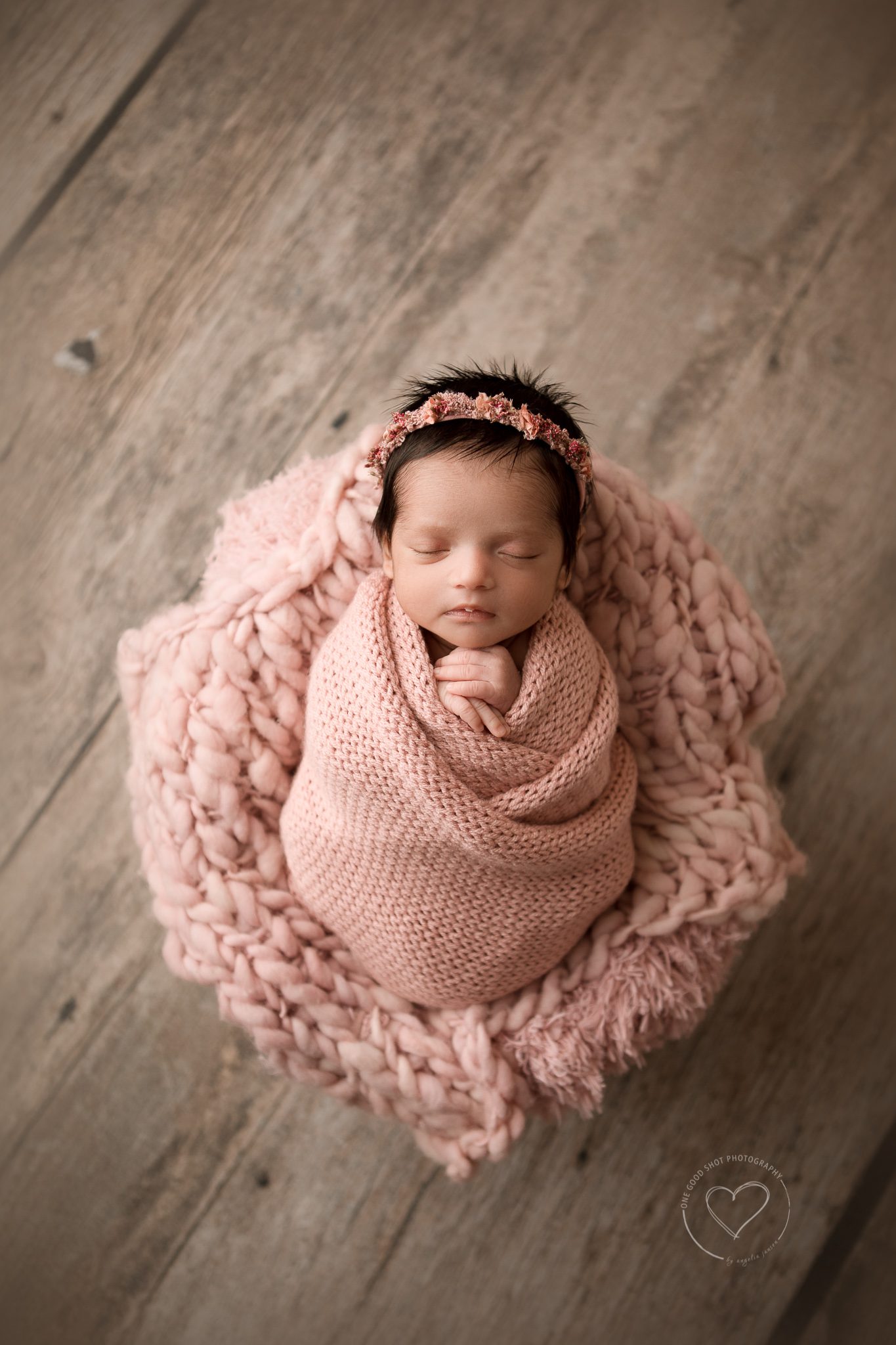 Newborn Photography, wrapped in pink, lying in bucket, bonnet