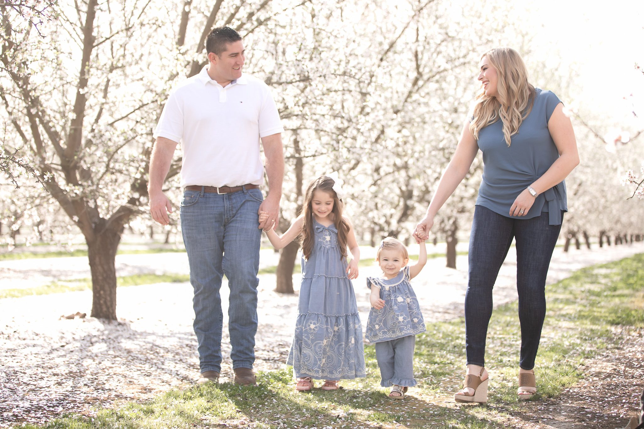 Family photos, walking in the blossoms holding hands