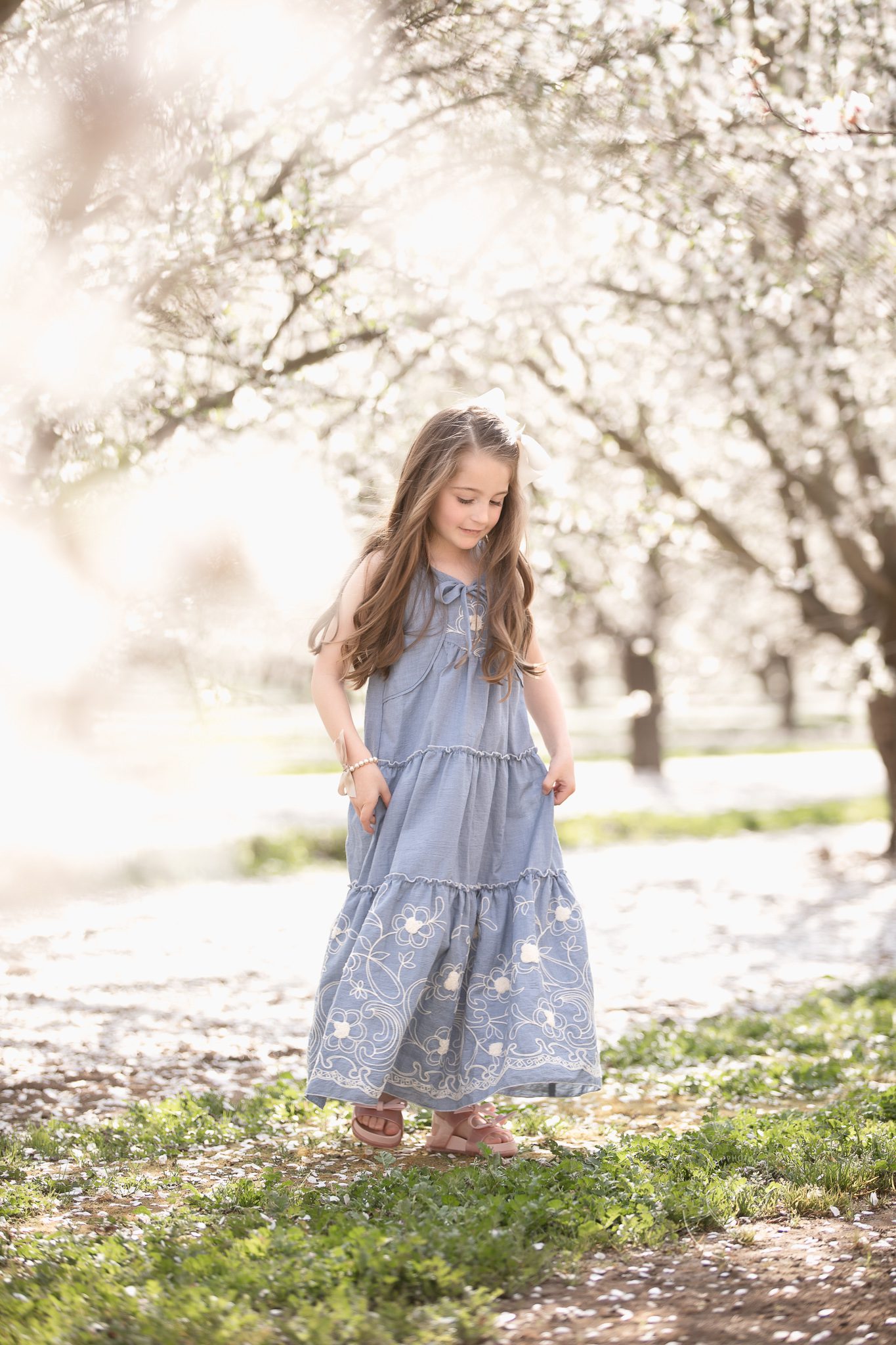 Beautiful girl, twirling in the blossom fields, blossom trail, fresno, clovis, ca