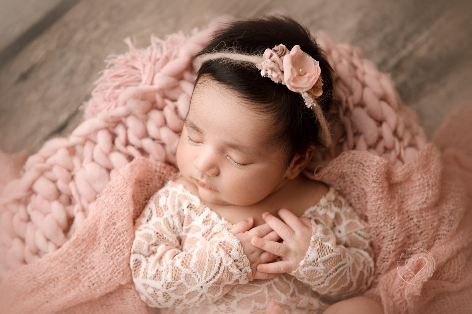 Newborn girl, hands oon heart, pink, wood, floral, Fresno photographer