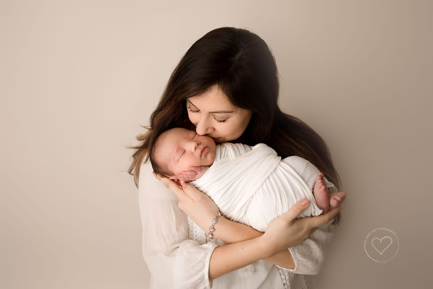 Fresno newborn Photographer, Mother son picture, mom kissing newborn baby, neutrals