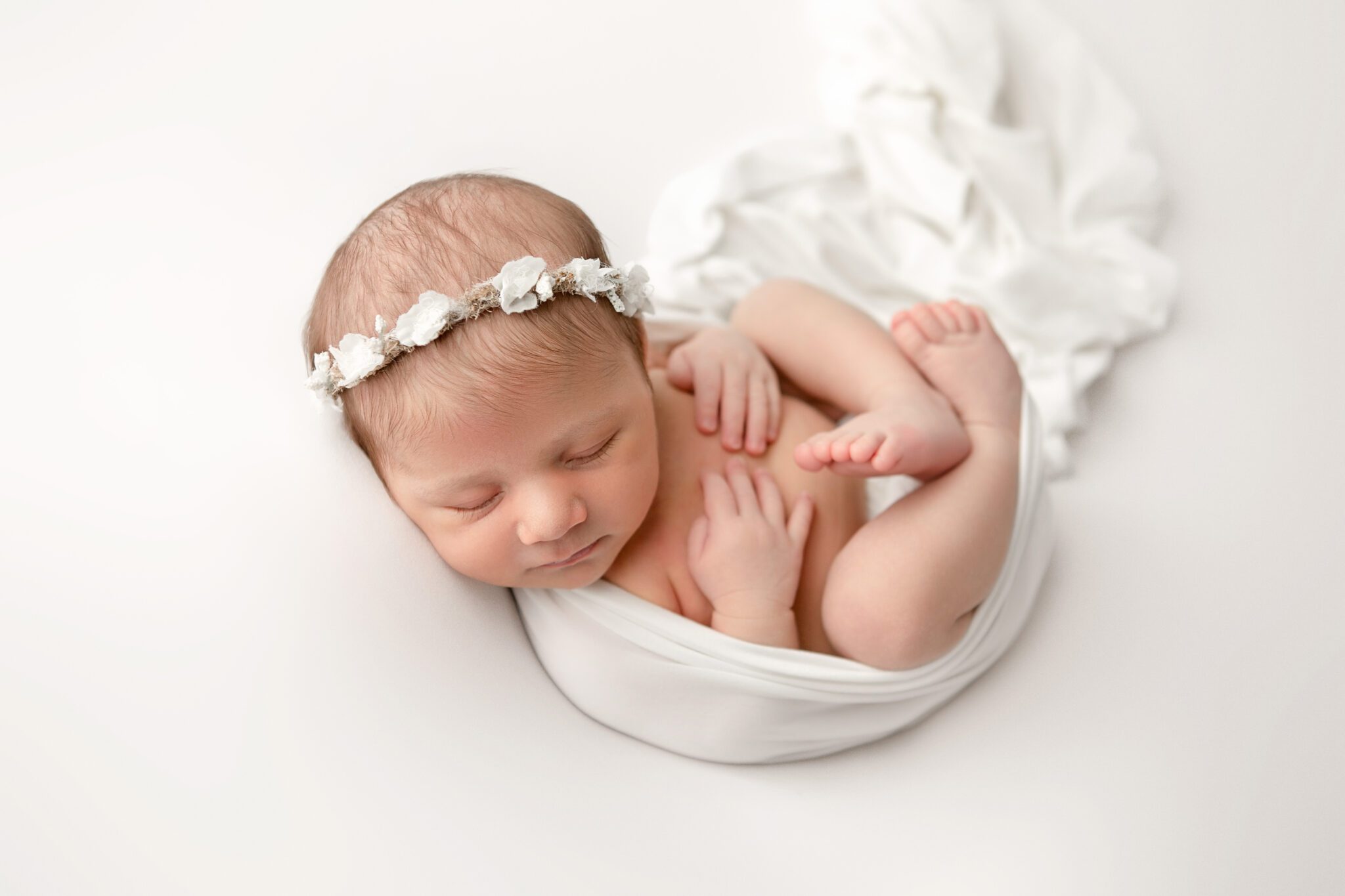 Newborn Girl wrapped in white, boho floral halo, fresno california