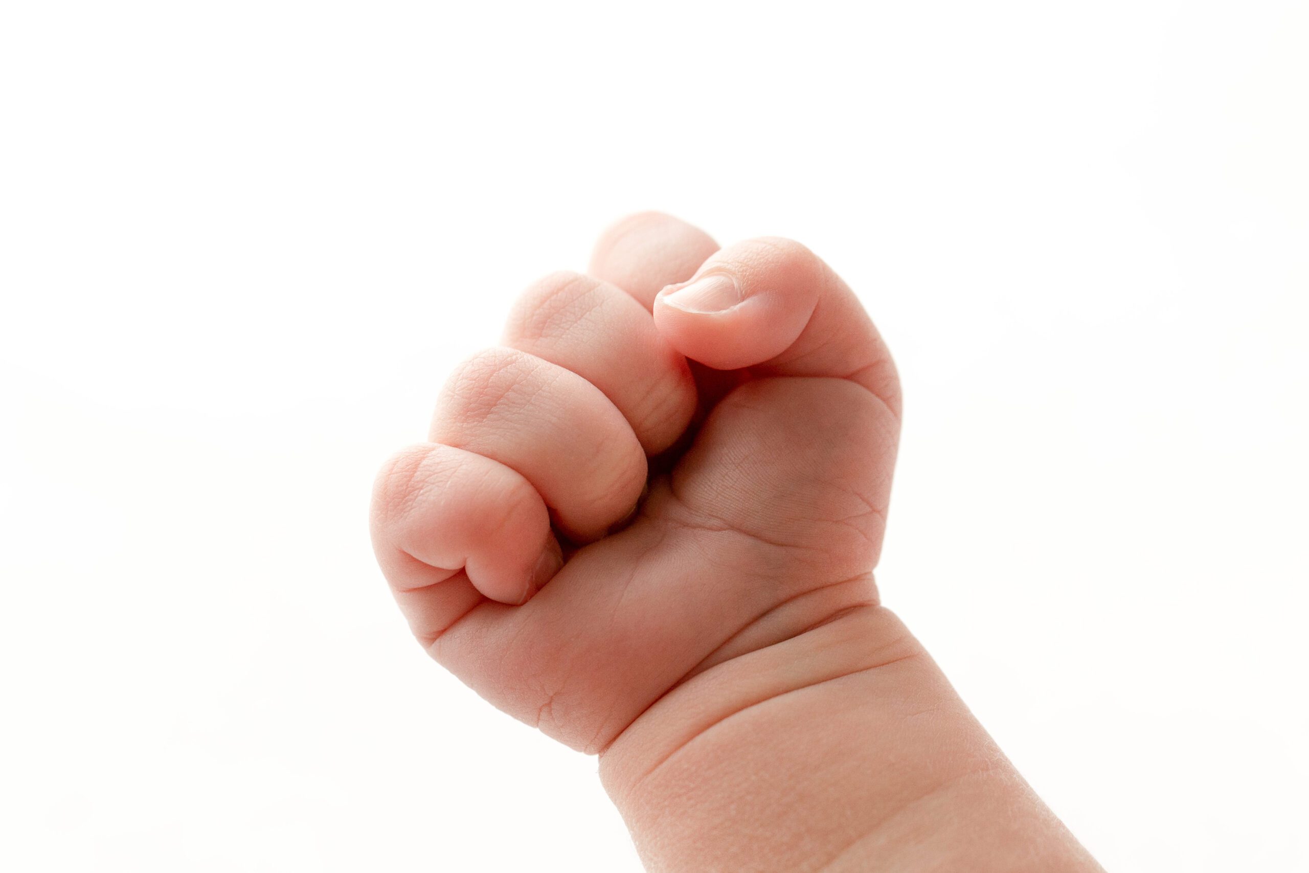 newborn baby fist, hand, macro, closeup, all white