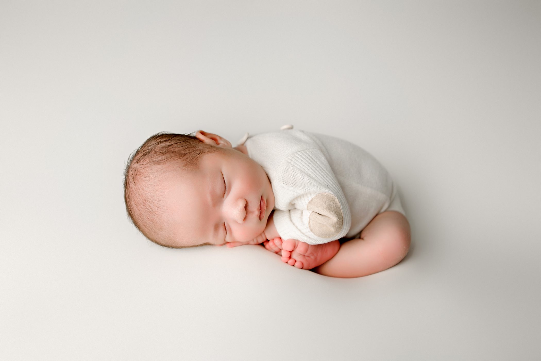 newborn baby boy, womb pose, cream outfit, fresno, clovis, california